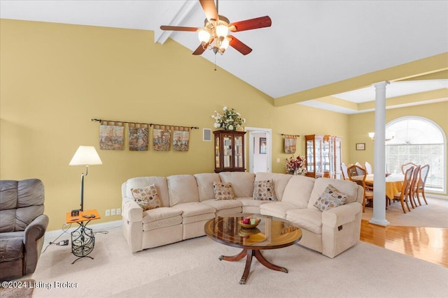 living area with beamed ceiling, ornate columns, a ceiling fan, carpet, and baseboards