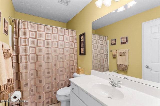 bathroom featuring visible vents, toilet, curtained shower, and vanity