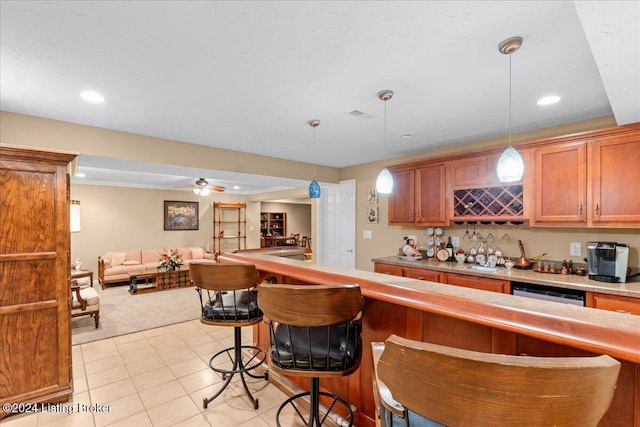 bar featuring recessed lighting, light tile patterned flooring, wet bar, light carpet, and pendant lighting