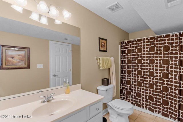 full bath featuring toilet, vanity, visible vents, and tile patterned floors