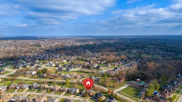 birds eye view of property featuring a residential view and a forest view