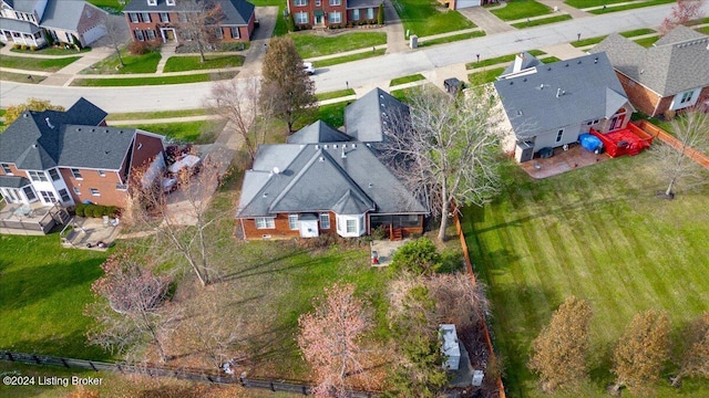 birds eye view of property with a residential view