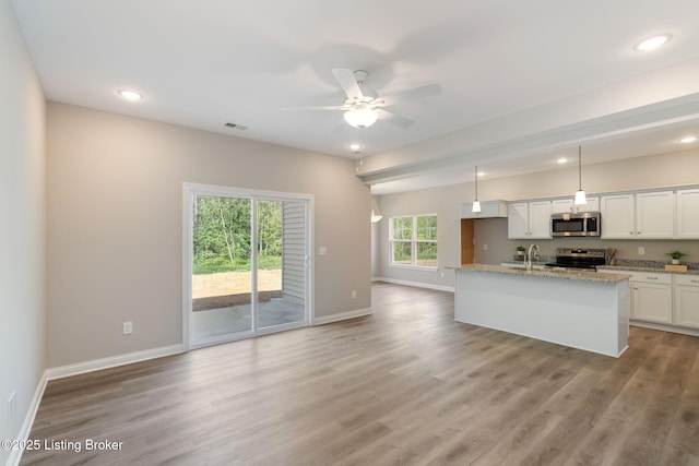 1332 Etawah Ave, Louisville, KY 40222 - kitchen with appliances with stainless steel finishes, ceiling fan, baseboards, light wood-style floors, and white cabinetry