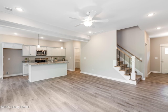 1332 Etawah Ave, Louisville, KY 40222 - kitchen with appliances with stainless steel finishes, baseboards, white cabinetry, and recessed lighting