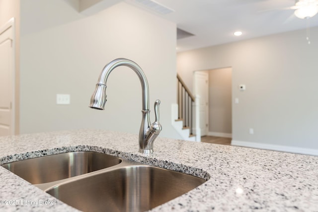 1332 Etawah Ave, Louisville, KY 40222 - kitchen view of a sink, ceiling fan, light stone countertops, and recessed lighting