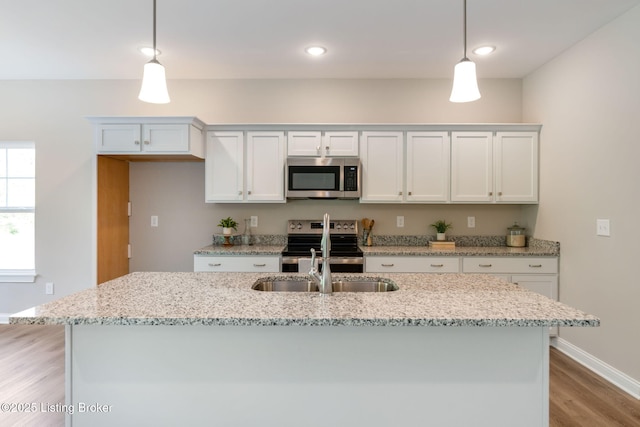 1332 Etawah Ave, Louisville, KY 40222 - kitchen featuring stainless steel microwave, electric range, light wood finished floors, decorative light fixtures, and recessed lighting