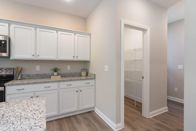 1332 Etawah Ave, Louisville, KY 40222 - kitchen with light wood finished floors, stainless steel appliances, baseboards, and white cabinets