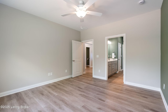 1332 Etawah Ave, Louisville, KY 40222 - unfurnished bedroom featuring light wood-style floors, baseboards, connected bathroom, and ceiling fan