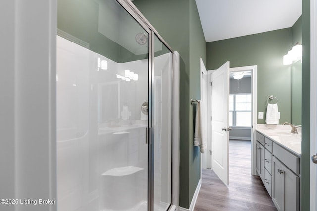1332 Etawah Ave, Louisville, KY 40222 - bathroom with a shower stall, double vanity, wood finished floors, and ceiling fan