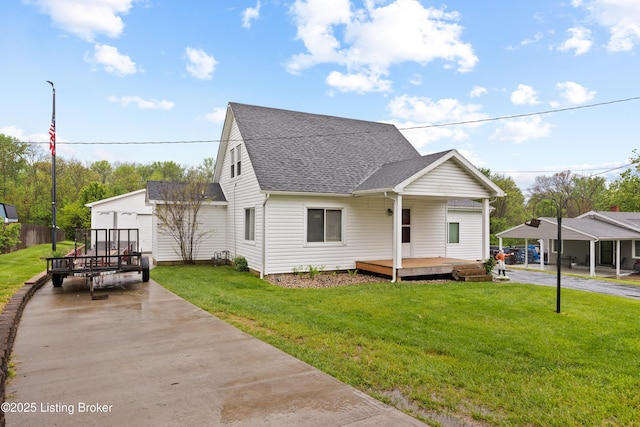 117 Fairview Dr, Waddy, KY 40076 - view of front of house featuring a front yard, driveway, and a shingled roof
