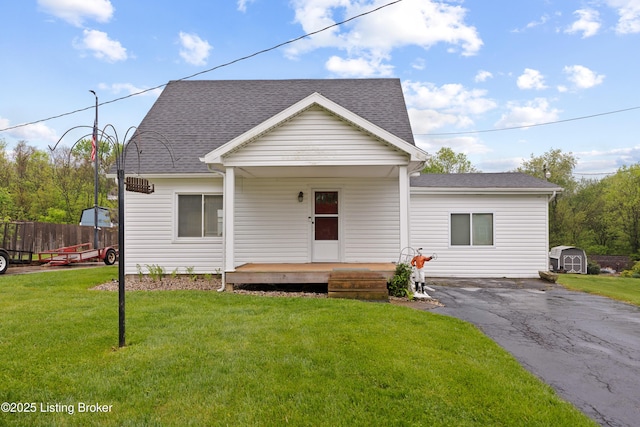 117 Fairview Dr, Waddy, KY 40076 - view of front of property featuring a front yard, fence, covered porch, and roof with shingles