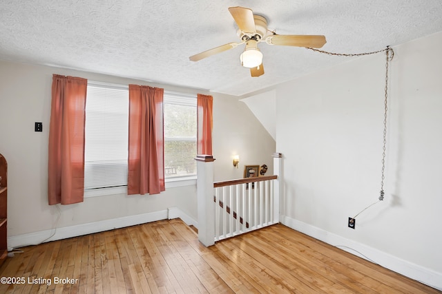 117 Fairview Dr, Waddy, KY 40076 - bonus room featuring a textured ceiling, light wood finished floors, and baseboards