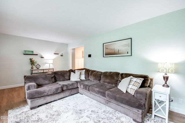 living room featuring wood finished floors and baseboards