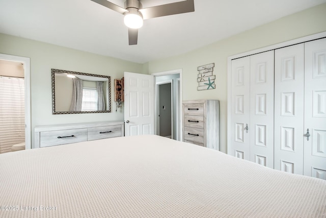bedroom with connected bathroom, a ceiling fan, and a closet
