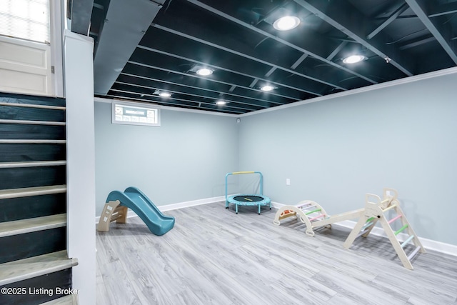 rec room featuring baseboards and wood finished floors