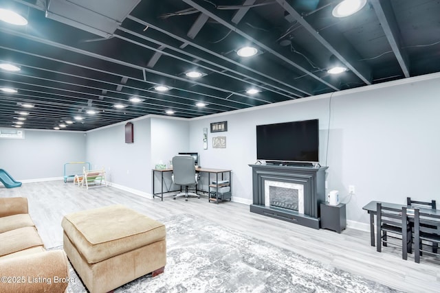 living room with baseboards and wood finished floors