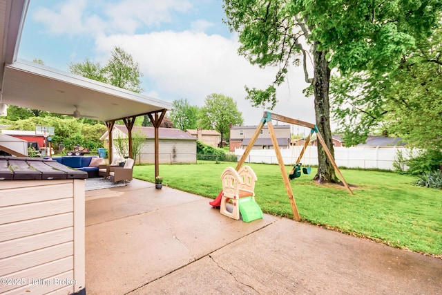 view of patio with a fenced backyard, an outdoor hangout area, ceiling fan, and a playground