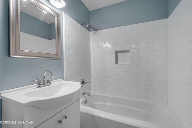 bathroom featuring shower / tub combination and vanity
