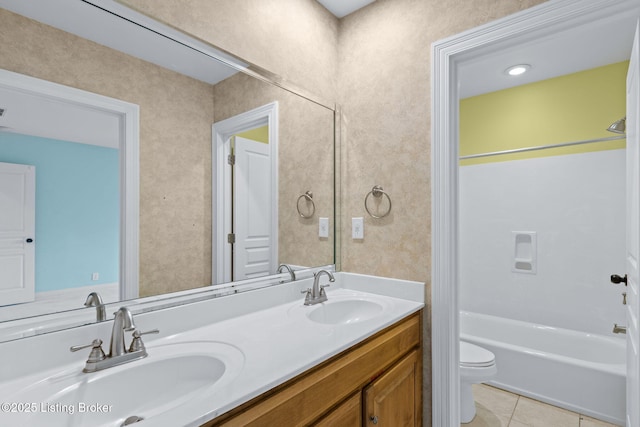 full bath featuring tile patterned flooring, a sink, double vanity, and toilet