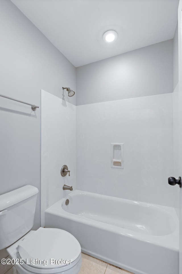 bathroom with shower / bathtub combination, toilet, and tile patterned flooring