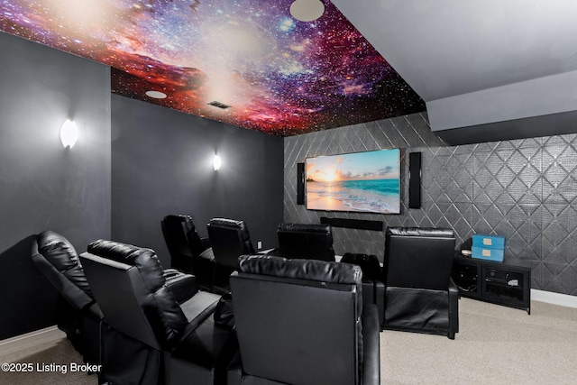 cinema room with visible vents, carpet flooring, and baseboards