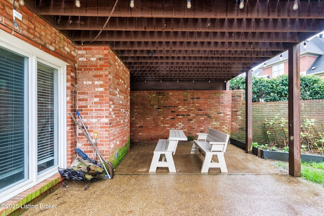 view of patio / terrace featuring fence