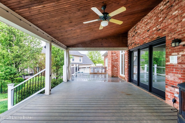 wooden terrace featuring a ceiling fan