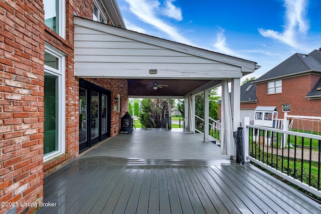 deck featuring a porch and a ceiling fan