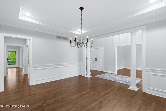 unfurnished dining area with visible vents, a decorative wall, dark wood-style floors, and an inviting chandelier