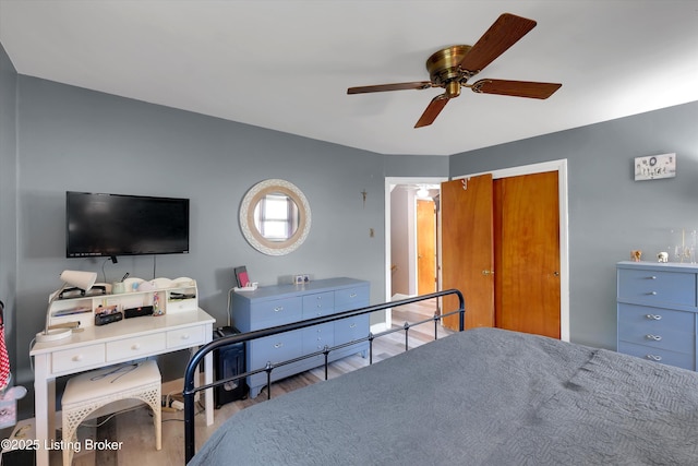 bedroom with wood finished floors and ceiling fan