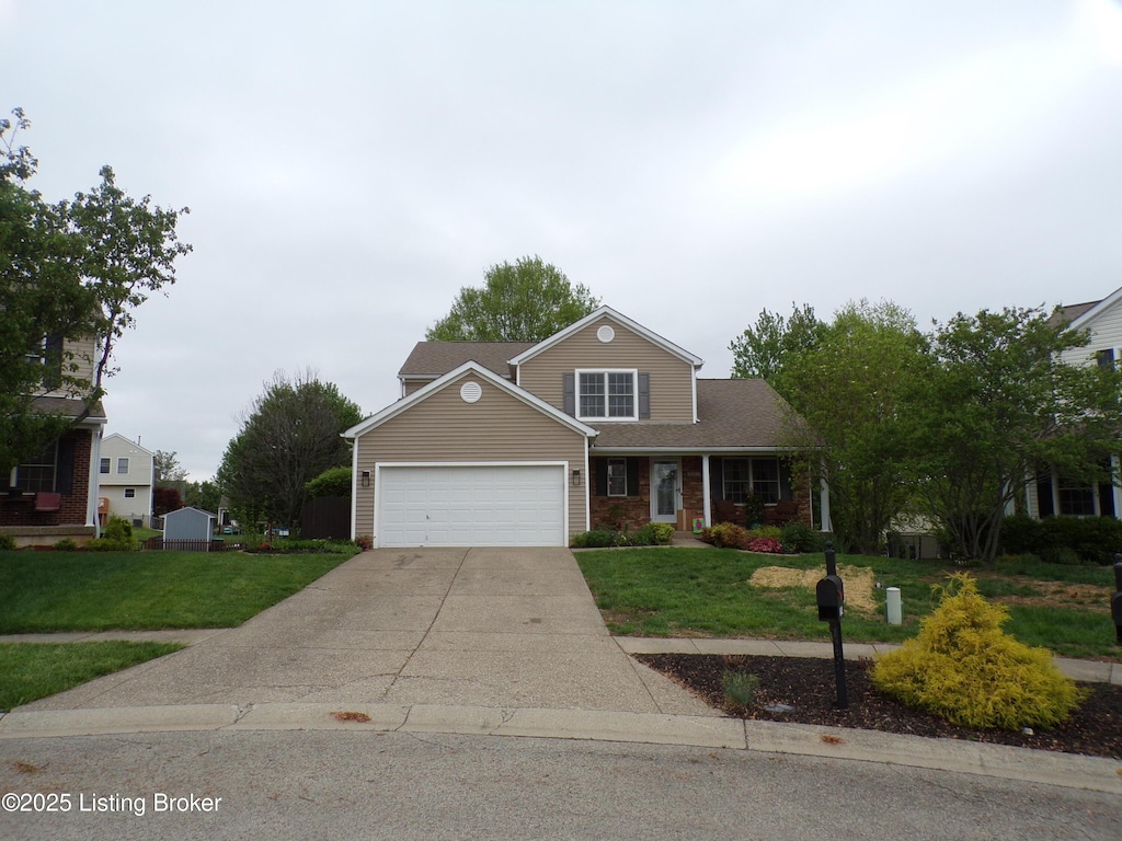 traditional-style home with a front lawn, driveway, an attached garage, and brick siding
