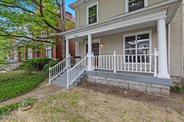 doorway to property featuring covered porch