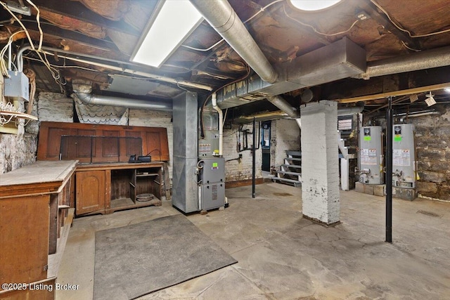 unfinished basement featuring gas water heater, heating unit, and stairs