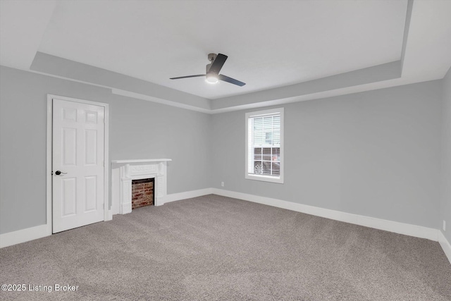 206 E Madison St, La Grange, KY 40031 - spare room with a ceiling fan, a fireplace, carpet, and baseboards