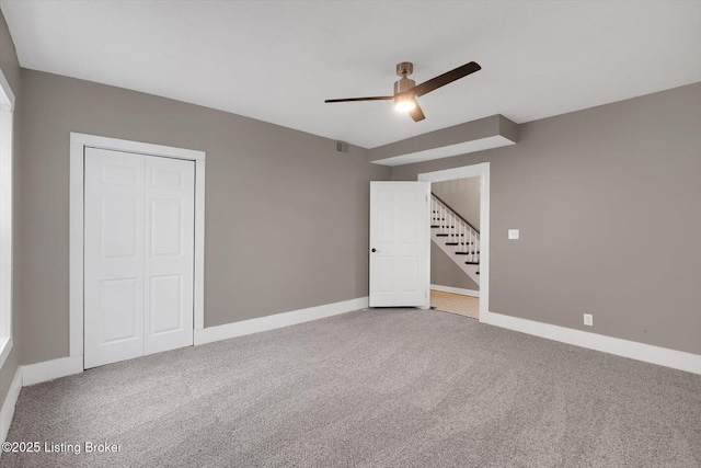 206 E Madison St, La Grange, KY 40031 - unfurnished bedroom with carpet, baseboards, a ceiling fan, and a closet