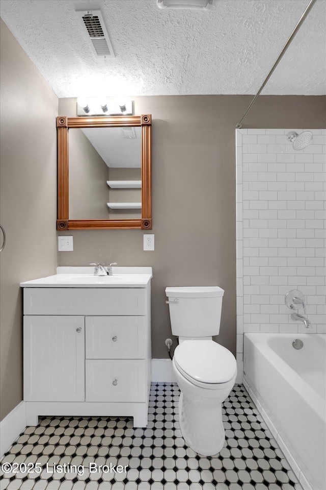 206 E Madison St, La Grange, KY 40031 - bathroom featuring vanity, toilet, shower / bathtub combination, baseboards, and a textured ceiling