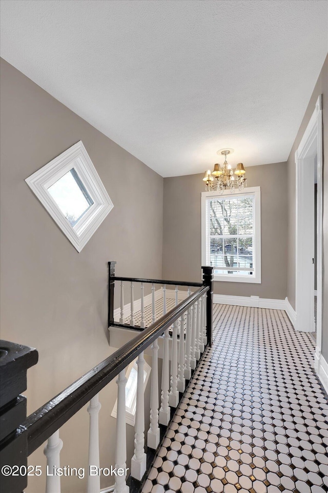206 E Madison St, La Grange, KY 40031 - hall with an upstairs landing, baseboards, a chandelier, and carpet floors