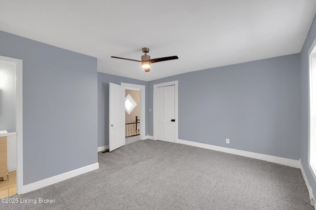 206 E Madison St, La Grange, KY 40031 - unfurnished bedroom with carpet flooring, baseboards, and a ceiling fan