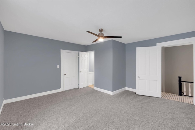 206 E Madison St, La Grange, KY 40031 - unfurnished bedroom with carpet, baseboards, and ceiling fan