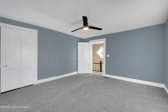 206 E Madison St, La Grange, KY 40031 - unfurnished bedroom with carpet flooring, baseboards, and a ceiling fan