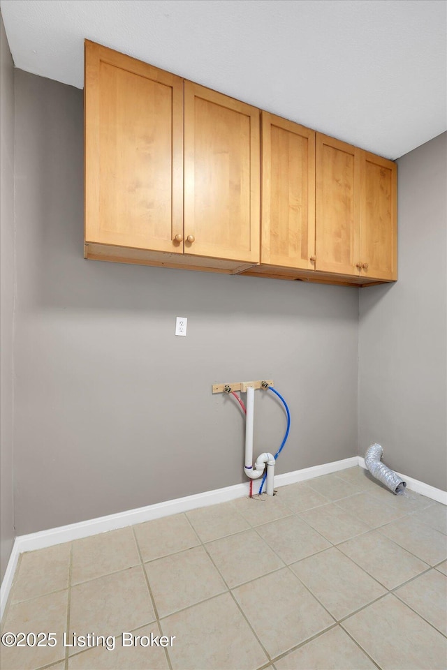 206 E Madison St, La Grange, KY 40031 - washroom with cabinet space, baseboards, hookup for a washing machine, and light tile patterned flooring