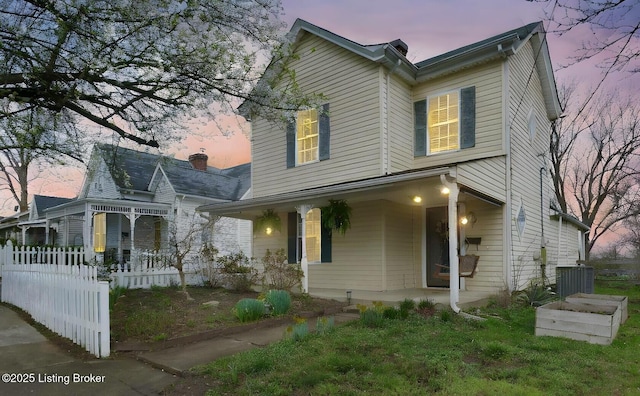 206 E Madison St, La Grange, KY 40031 - view of front of home featuring covered porch and central AC unit