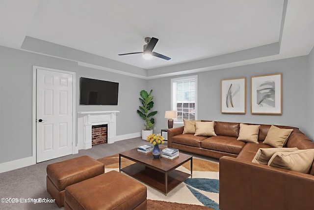 206 E Madison St, La Grange, KY 40031 - living room featuring carpet floors, baseboards, ceiling fan, and a raised ceiling