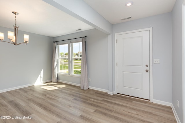 112 Shadow Rock Ct, Shepherdsville, KY 40165 - foyer entrance with baseboards, visible vents, a notable chandelier, and light wood finished floors