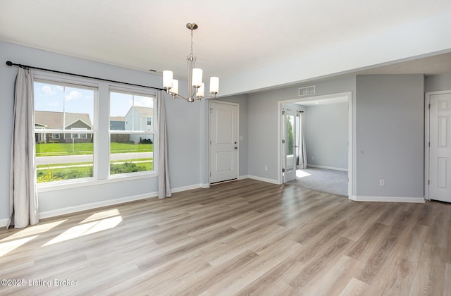 112 Shadow Rock Ct, Shepherdsville, KY 40165 - unfurnished dining area featuring light wood-type flooring, visible vents, an inviting chandelier, and baseboards