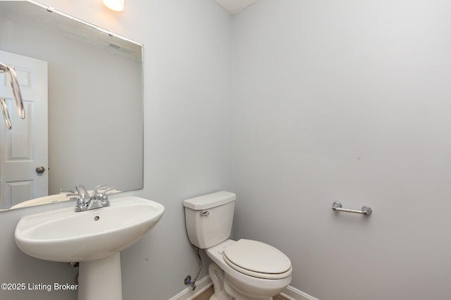112 Shadow Rock Ct, Shepherdsville, KY 40165 - bathroom with toilet, a sink, visible vents, and baseboards
