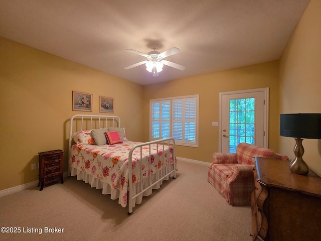 bedroom with access to exterior, carpet, and baseboards