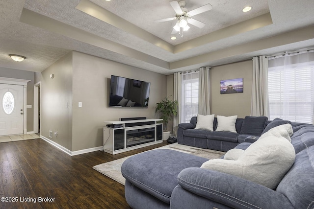 216 Willow Creek Dr, Mt Washington, KY 40047 - living area featuring baseboards, a textured ceiling, and a tray ceiling