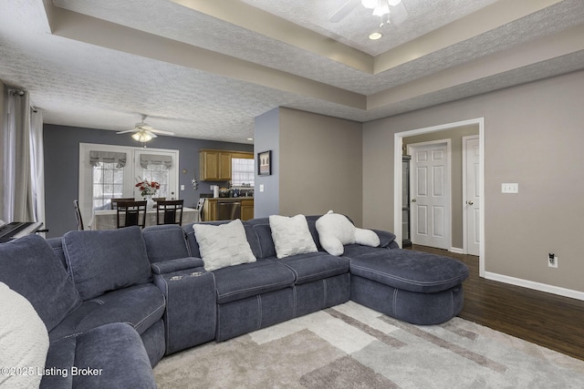 216 Willow Creek Dr, Mt Washington, KY 40047 - living room featuring baseboards, a ceiling fan, a textured ceiling, and light wood finished floors