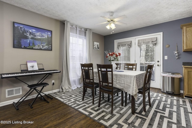 216 Willow Creek Dr, Mt Washington, KY 40047 - dining space featuring wood finished floors, ceiling fan, baseboards, visible vents, and a textured ceiling